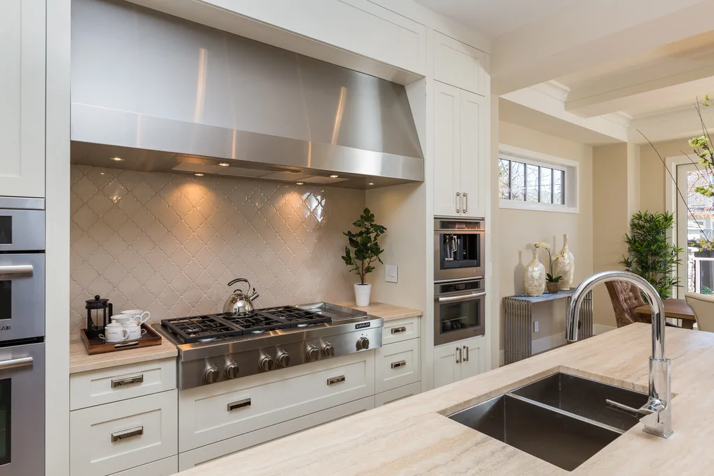 A modern kitchen features sleek appliances, a spacious countertop, and stylish decor